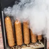 Sausages are being smoked in a smoker. Produktbild-Vorschau