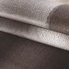 A close-up view of folded fabric with a textured pattern. Produktbild-Vorschau