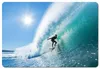 A surfer riding a large wave on a sunny day. Produktbild-Vorschau