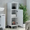 A white bathroom cabinet with its door open, showing shelves with towels and toiletries, next to a sink and a large potted plant. Podgląd zdjęcia produktu