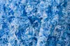 A close-up, textured view of blue and white yarn. Náhled obrázku produktu