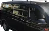 Side view of a black van with silver roof racks. Náhľad obrázku produktu
