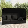 An outdoor lounge bed with a canopy and cushions on a wooden deck, surrounded by trees and greenery. Produktbild-Vorschau
