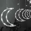 A string of crescent moon-shaped lights with LED bulbs, hanging in a dark setting. Náhľad obrázku produktu