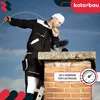 A chimney sweep is cleaning a chimney on a rooftop. Produktbild-Vorschau