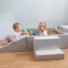 Two young children playing in a soft play area with colorful balls. Produktbild-Vorschau