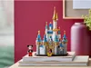 A LEGO Disney castle set with a Mickey Mouse minifigure on a stack of books, with a red wall and a vase in the background. Produktbild-Vorschau
