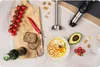 A flat lay of ingredients and a hand blender, suggesting preparation of a dish like hummus. Náhľad obrázku produktu