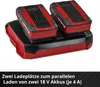 A close-up, angled view of a dual battery charger with two batteries inserted. Voir les images du produit