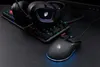 A gaming mouse and headset are placed on a keyboard. Produktbild-Vorschau