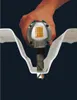 A hand holding a Makita JN1601 Knabber tool, demonstrating its use on a white material. Podgląd zdjęcia produktu