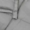 A close-up view of the stitching and fabric of a gray weighted blanket. Podgląd zdjęcia produktu