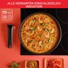A cooking pan with shrimp curry on an induction stovetop, next to a kitchen utensil and small bowls of spices and chopped tomatoes. Produktbild-Vorschau