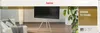A living room scene with a TV stand holding a TV, a sofa, and a plant. Voir les images du produit