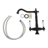 A black faucet with two white handles and two silver hoses, along with some small parts, are laid out on a white background. Podgląd zdjęcia produktu