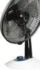 A close-up shot of a black and white oscillating fan, viewed from a slightly low angle. Náhľad obrázku produktu