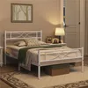 A bedroom scene with a white metal bed frame. Produktbild-Vorschau