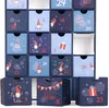 A close-up, front-facing view of a blue advent calendar with 24 numbered drawers, some of which are open, revealing a white interior. The calendar is decorated with gnome and Christmas-themed illustrations. Náhľad obrázku produktu