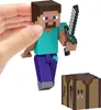 A hand holding a Minecraft Steve action figure with a sword, next to a crafting table. Produktbild-Vorschau