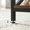 Close-up of a table leg with an adjustable foot on a carpet. Produktbild-Vorschau