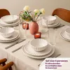 A table setting for six people with dinnerware, glasses, and candles. Náhled obrázku produktu