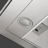 Close-up view of the underside of a stainless steel range hood, showing a light and a ventilation grate. Produktbild-Vorschau
