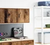A garage or workshop setting with storage units and tools. Podgląd zdjęcia produktu