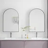 A modern bathroom vanity with two arched mirrors, sinks, and faucets. Produktbild-Vorschau