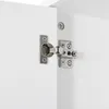 A close-up view of a cabinet hinge on a white surface. Náhled obrázku produktu