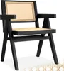 A black armchair with a cane seat and back. Produktbild-Vorschau