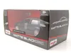 A toy car in its packaging. Voir les images du produit