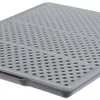 A close-up, angled view of a gray plastic mat with a grid of holes. Produktbild-Vorschau
