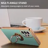 A phone case with a ring stand is shown on a desk next to a laptop and a coffee cup. Náhľad obrázku produktu