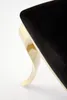 A close-up shot of the leg and seat of a chair. Podgląd zdjęcia produktu