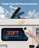 A close-up of a camper van window and roof with a remote control in hand, showing a product feature. Podgląd zdjęcia produktu