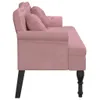 Side view of a pink velvet bench with two decorative pillows and black legs. Náhľad obrázku produktu