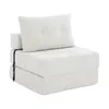 A beige foldable sofa bed with a pillow, shown in a studio setting. Náhled obrázku produktu
