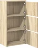 A close-up view of an open wooden cabinet with three shelves. Podgląd zdjęcia produktu