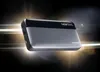 A power bank is shown against a dark, abstract background with light streaks. Náhľad obrázku produktu