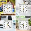 Collage of four images showing an alarm clock in different settings: travel, bedroom, office, and living room. Produktbild-Vorschau