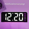 A digital clock displaying the time and day of the week, with colored lighting at the bottom. Produktbild-Vorschau