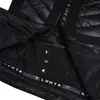 Close-up view of the interior of a black jacket, showing quilted lining, zippers, and brand logo. Produktbild-Vorschau
