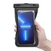 A hand holds a black waterproof phone case with a smartphone inside. Náhľad obrázku produktu