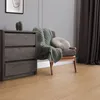 A room scene with a dresser, chair, and curtains. Produktbild-Vorschau
