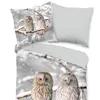 A bedding set with a winter owl print, including a duvet cover and pillowcase, displayed on a bed. Produktbild-Vorschau