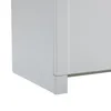 A close-up view of the bottom corner of a white sideboard or cabinet, showing its base and a portion of its side. Podgląd zdjęcia produktu