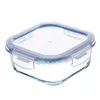 A clear studio shot of a glass food storage container with a blue lid. Produktbild-Vorschau