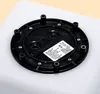 The underside of a black solar-powered garden light, showing mounting points and a label with product information. Produktbild-Vorschau