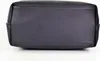 The bottom of a black handbag is shown against a white background. Produktbild-Vorschau