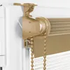 Close-up view of the mounting bracket and roller mechanism of a beige roller blind. Produktbild-Vorschau